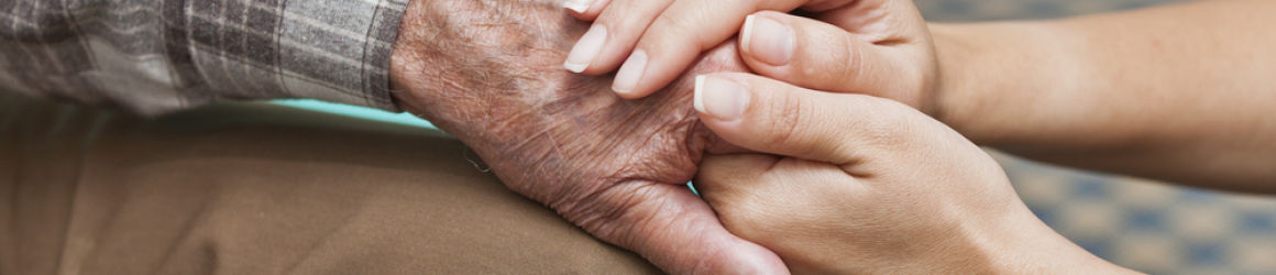 woman-holding-hands-of-grandfather
